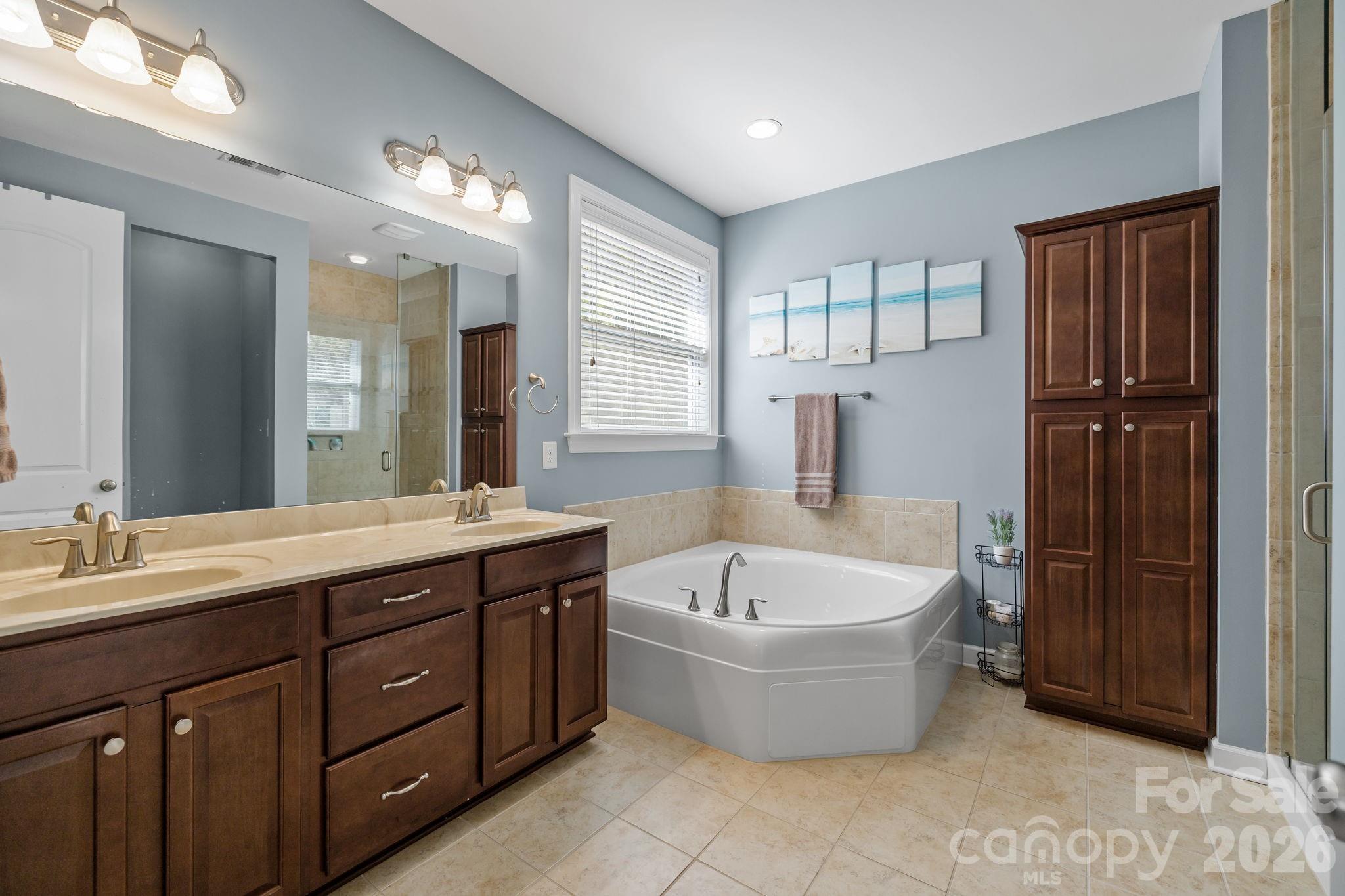 2072 Clarion Drive Fort Mill, SC 29707 - Photo 30 of 47 a spacious bathroom with a tub sink and mirror