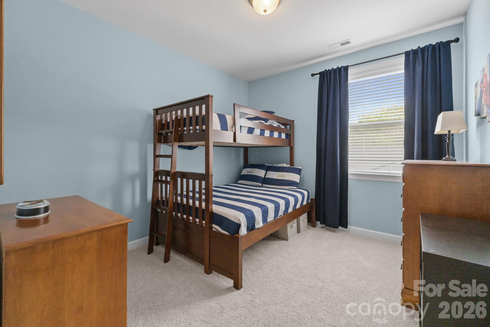 2072 Clarion Drive Fort Mill, SC 29707 - Photo 32 of 47 a bedroom with a bed and wooden floor