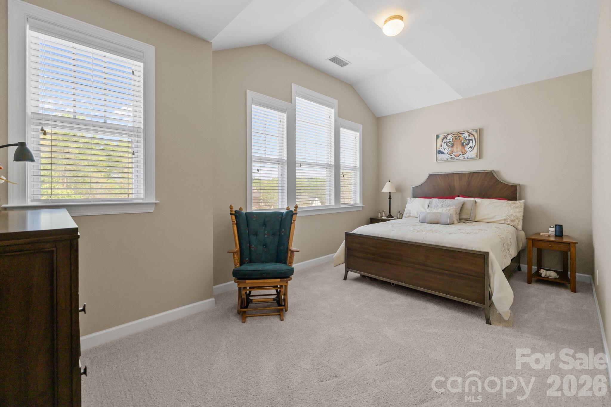 2072 Clarion Drive Fort Mill, SC 29707 - Photo 34 of 47 a bedroom with a bed table chair and a window