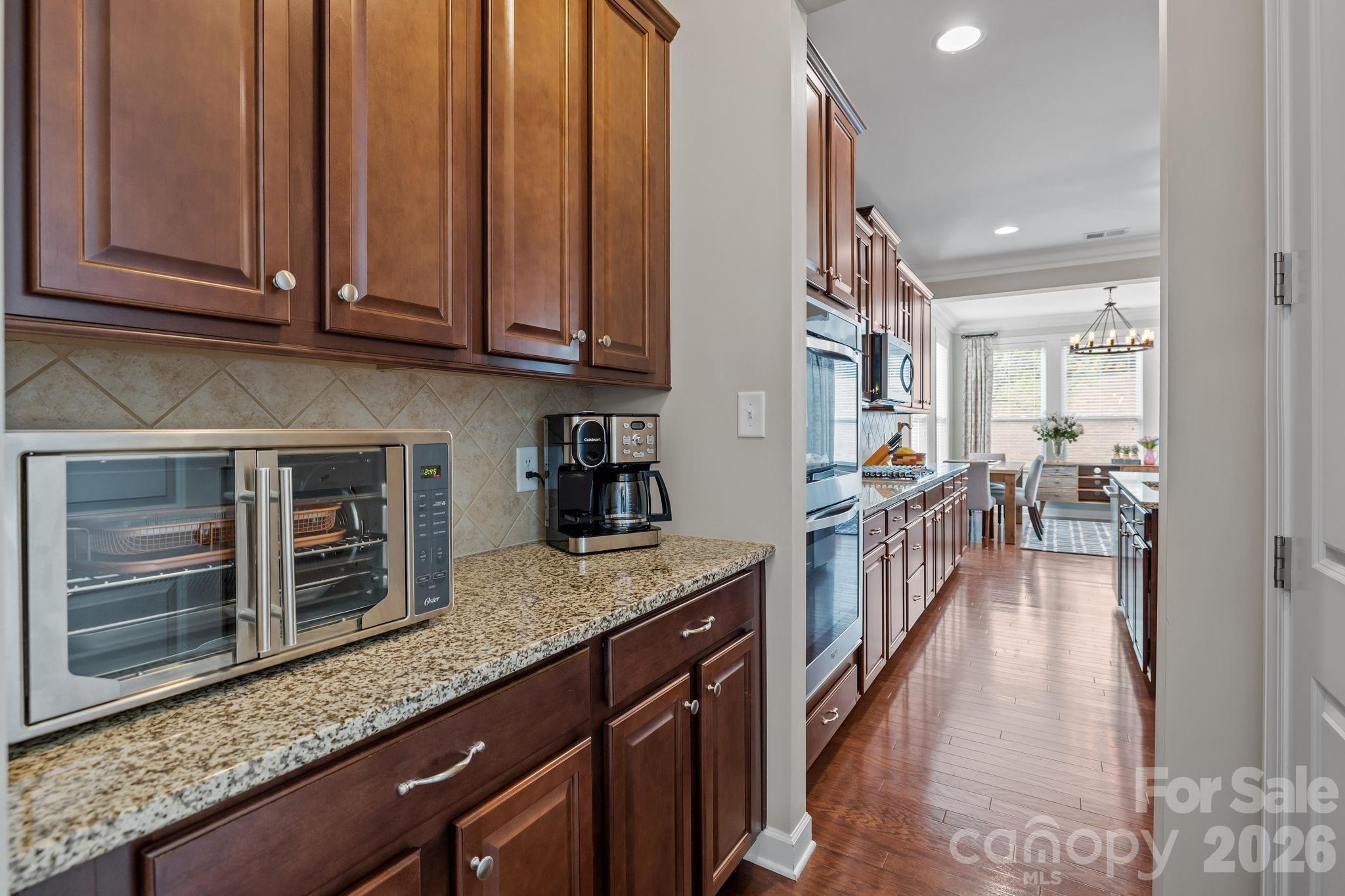 2072 Clarion Drive Fort Mill, SC 29707 - Photo 9 of 47 a kitchen with stainless steel appliances granite countertop a stove a sink and a refrigerator