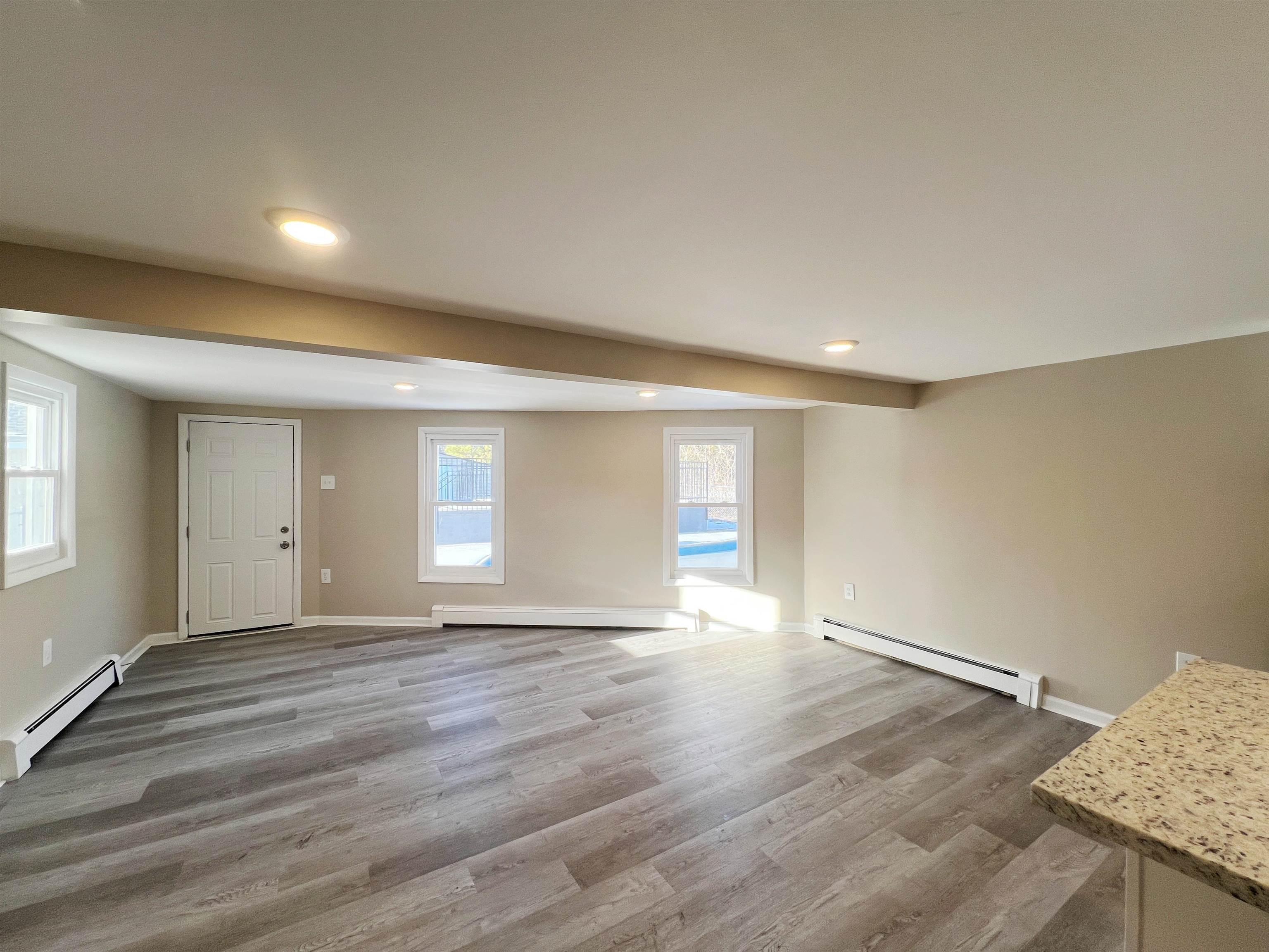 1340 Highway 9 Palermo, NJ 08230 - Photo 13 of 32 a view of an empty room with window and wooden floor