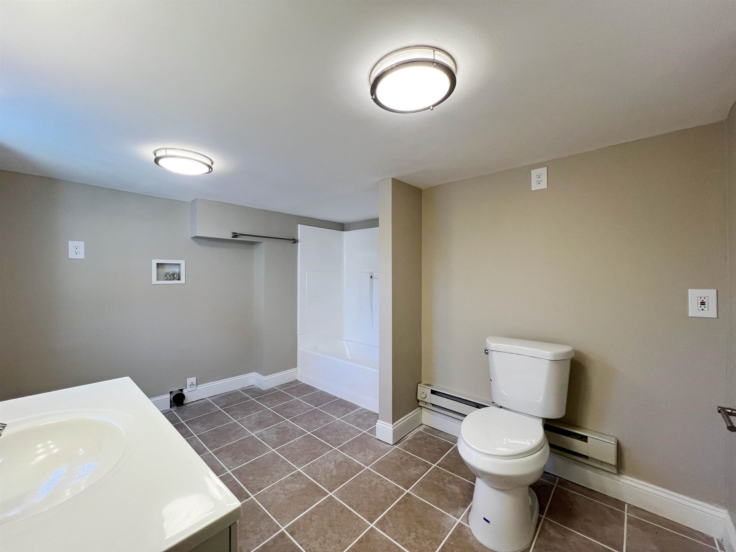 1340 Highway 9 Palermo, NJ 08230 - Photo 27 of 32 a bathroom with a toilet a sink and a mirror