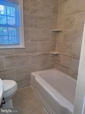 a view of hallway with wooden floor