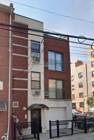 a front view of a building with glass windows