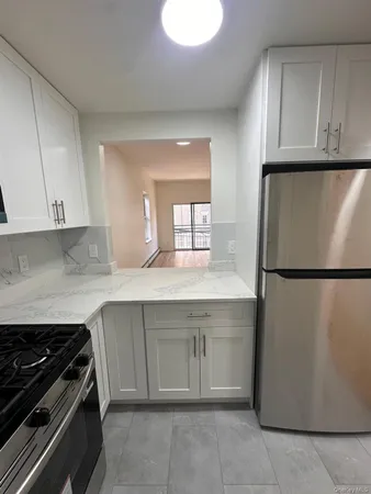 a kitchen with a sink and a refrigerator