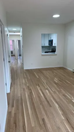 a view of a kitchen from the hallway