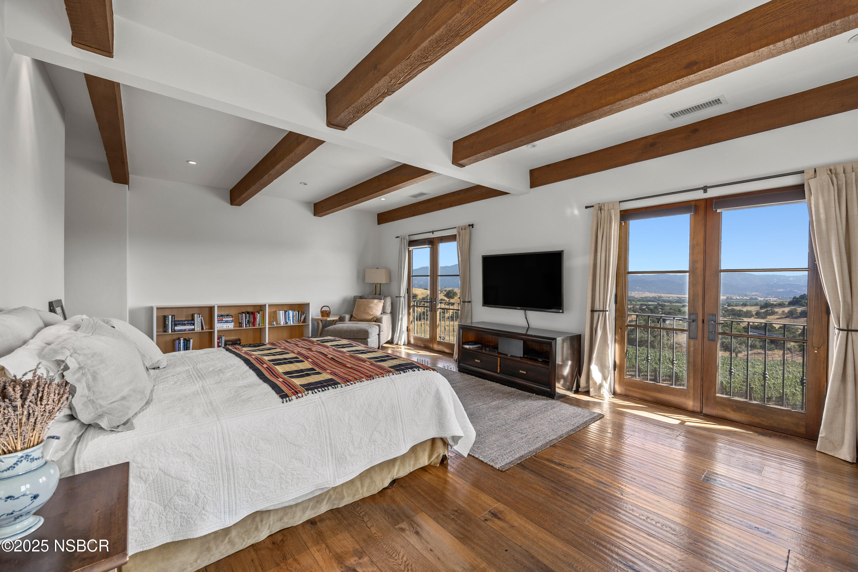 3001 Long Valley Road Santa Ynez, CA 93460 - Photo 20 of 52 a spacious bedroom with a large bed and a flat screen tv