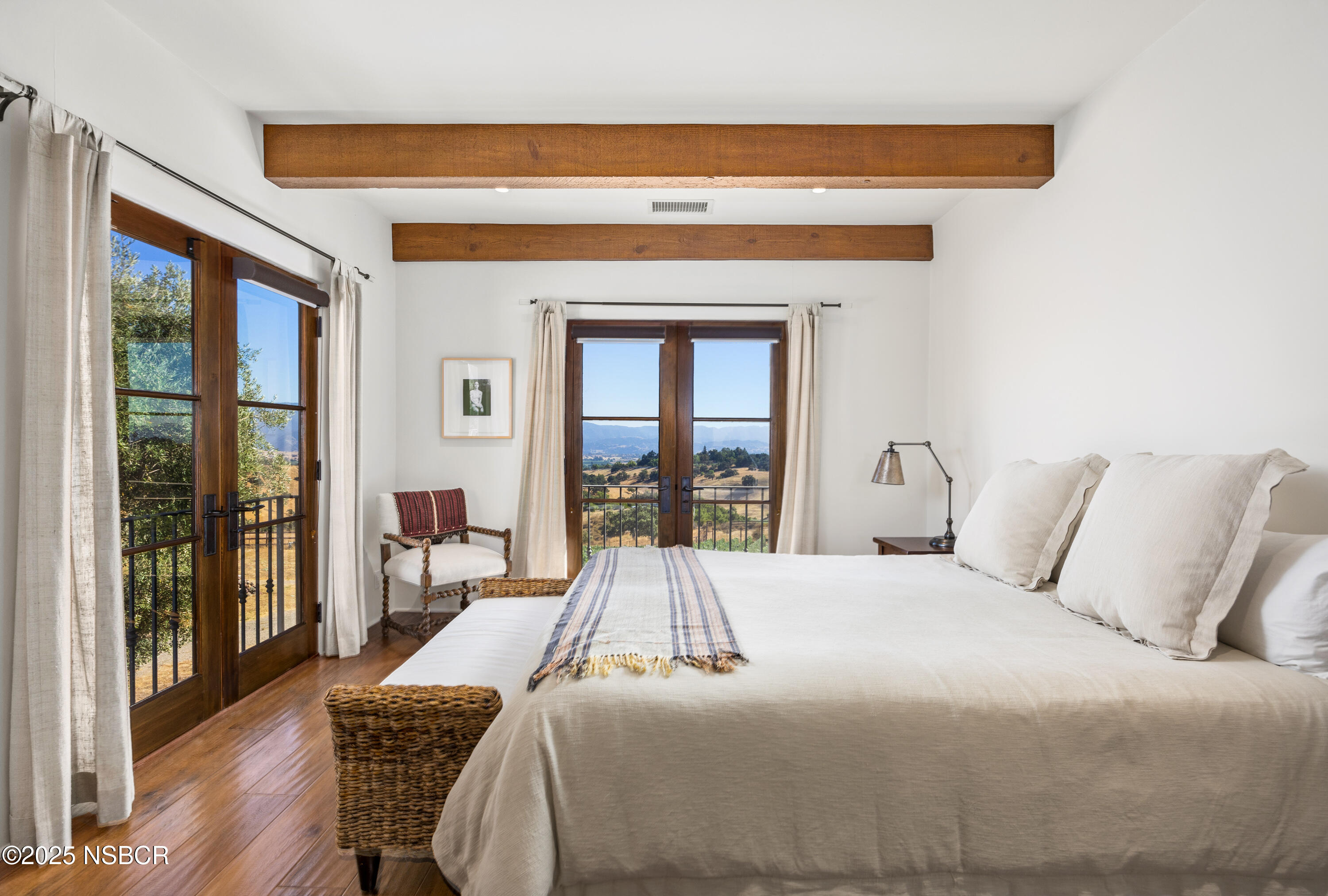 3001 Long Valley Road Santa Ynez, CA 93460 - Photo 28 of 52 a bedroom with a bed and a large window with outer view