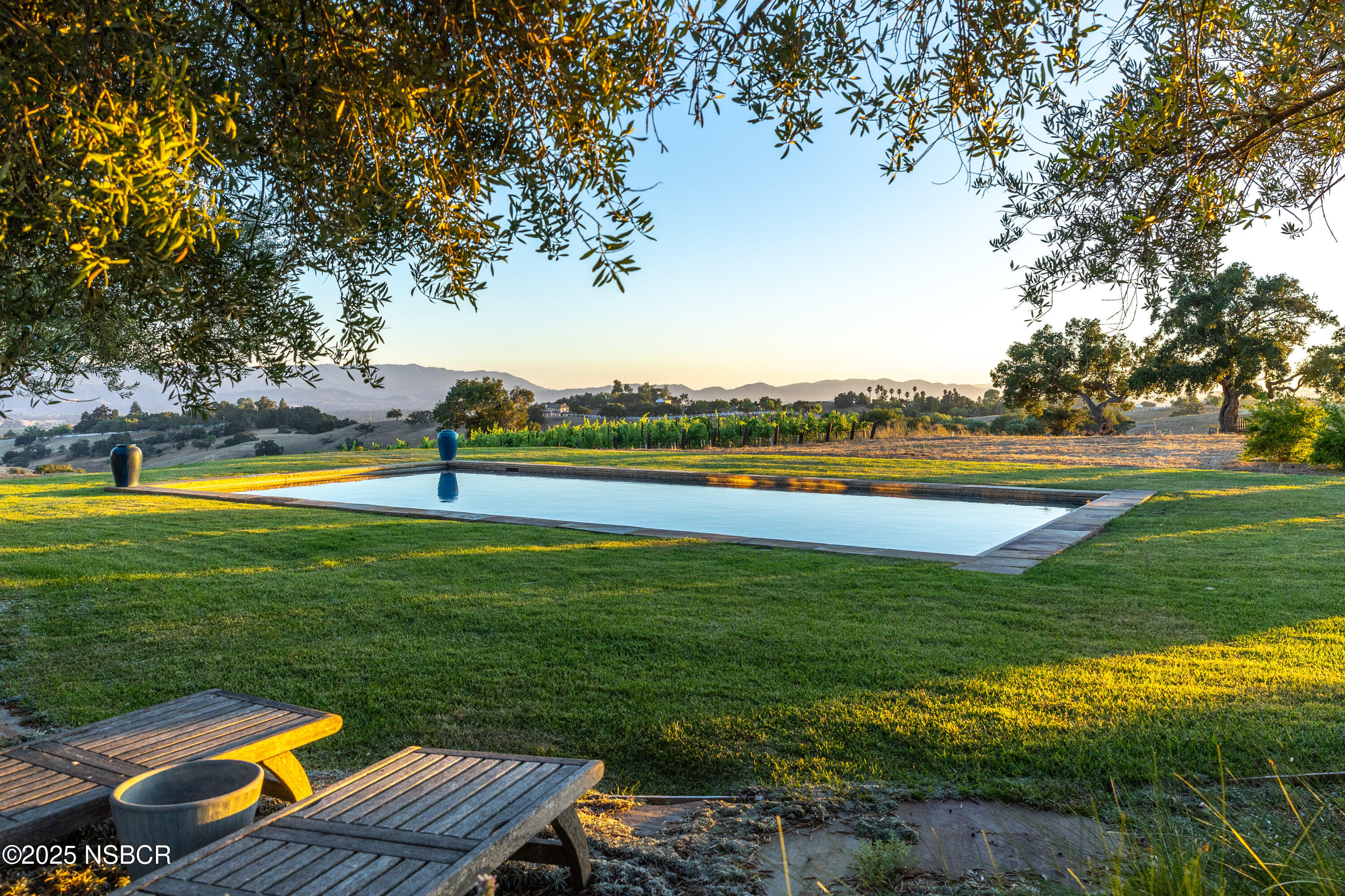3001 Long Valley Road Santa Ynez, CA 93460 - Photo 32 of 52 a view of a swimming pool and lounge chairs in back yard