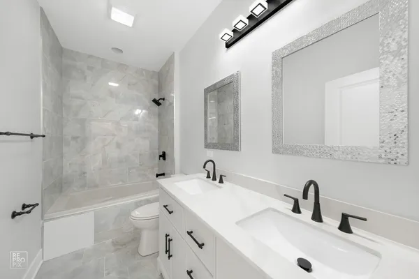 a bathroom with a toilet a sink and a bathtub