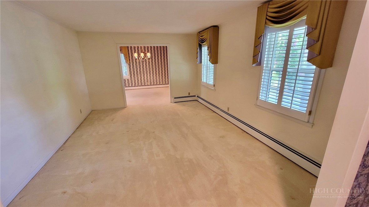 247 Crest Drive Boone, NC 28607 - Photo 9 of 19 an empty room with windows and closet