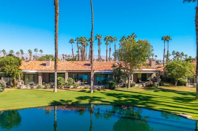 a front view of a building with garden