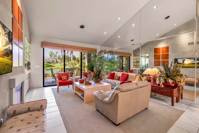 a living room with fireplace furniture and a flat screen tv