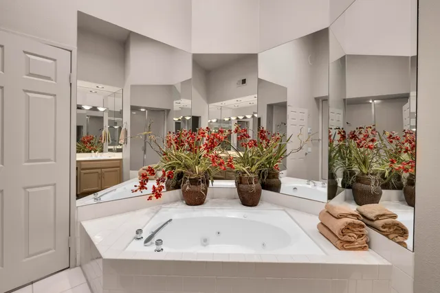 a bedroom with furniture and a flat screen tv