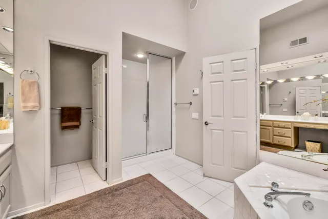 a bedroom with bed and window