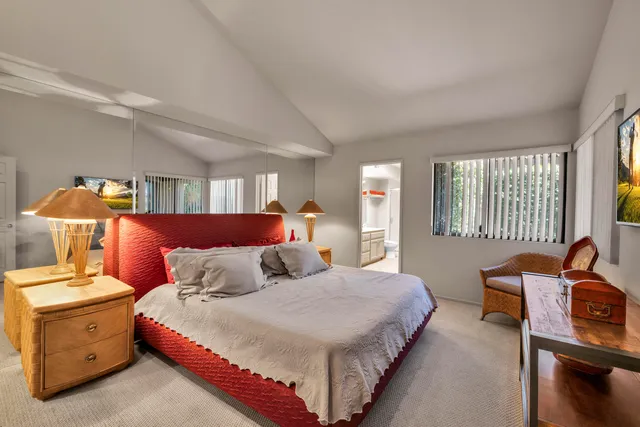 a living room with furniture and a bookshelf