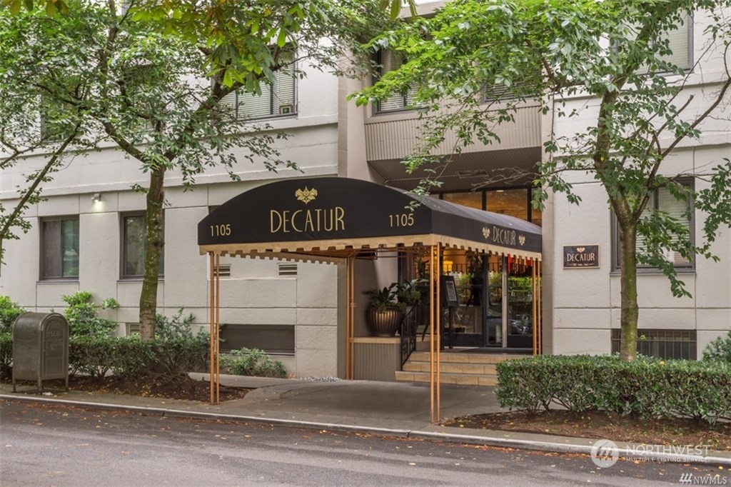 1105 Spring Street, Unit 305 Seattle, WA 98104 - Photo 1 of 25 a view of a building with street
