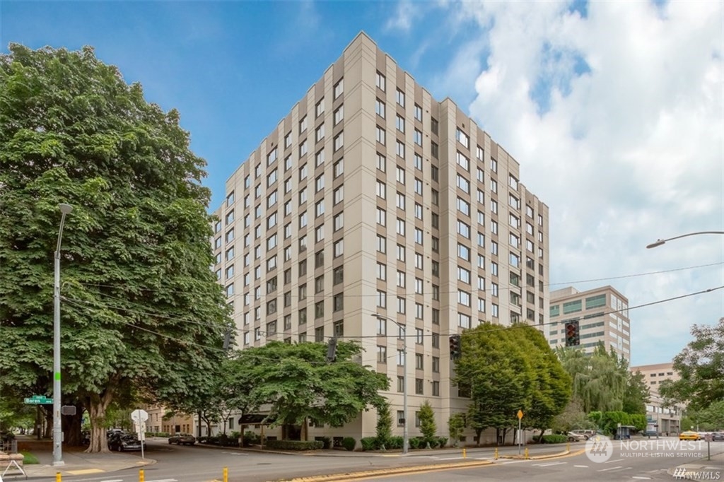1105 Spring Street, Unit 305 Seattle, WA 98104 - Photo 12 of 25 a view of a tall building next to a road