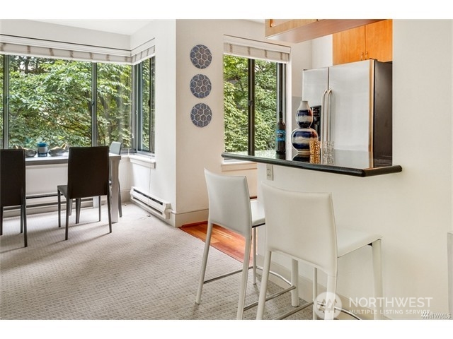 1105 Spring Street, Unit 305 Seattle, WA 98104 - Photo 18 of 25 a balcony with furniture and a window