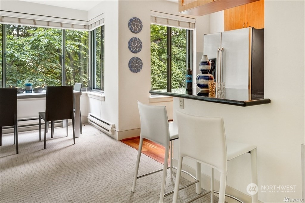 1105 Spring Street, Unit 305 Seattle, WA 98104 - Photo 8 of 25 a view of a livingroom with furniture and a window