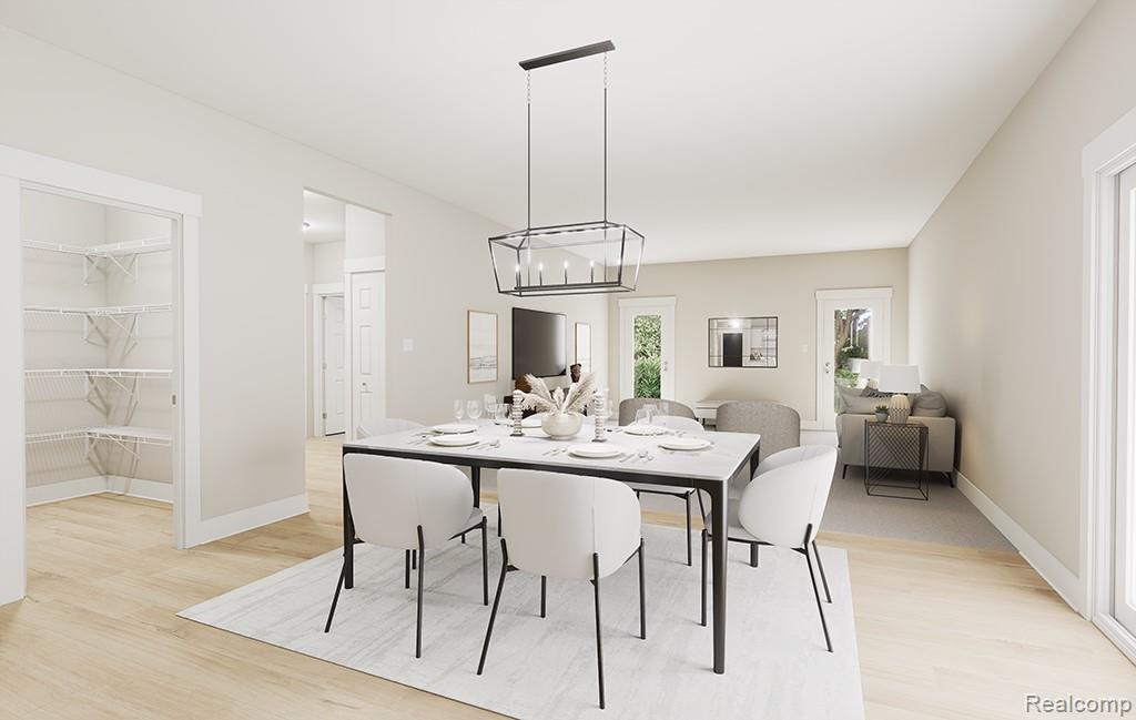 61659 Empire Road South Lyon, MI 48178 - Photo 5 of 21 Dining area with light wood-type flooring and a chandelier