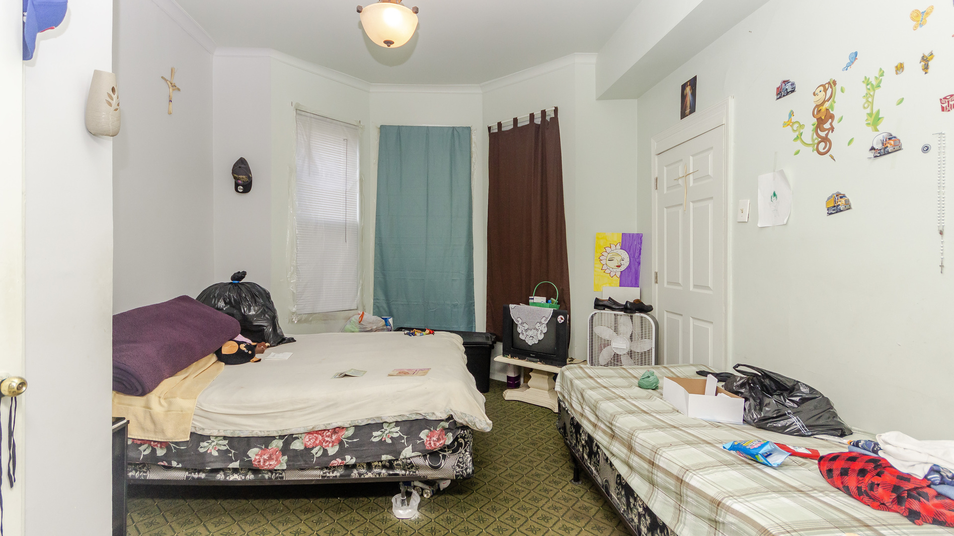 3323 North Pulaski Road Chicago, IL 60641 - Photo 11 of 12 a bedroom with a bed and a window