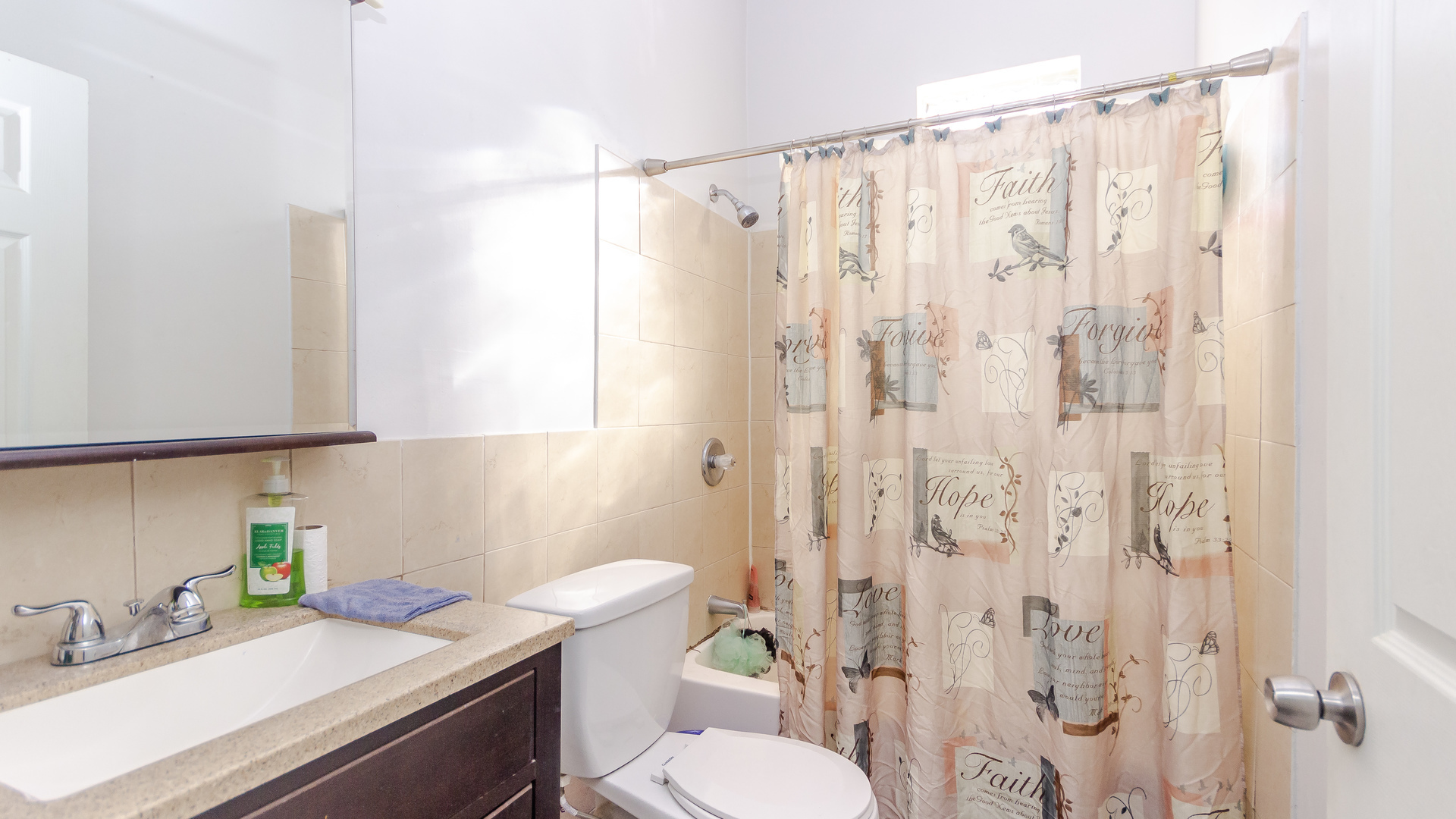 3323 North Pulaski Road Chicago, IL 60641 - Photo 12 of 12 a bathroom with a sink a toilet and shower curtain