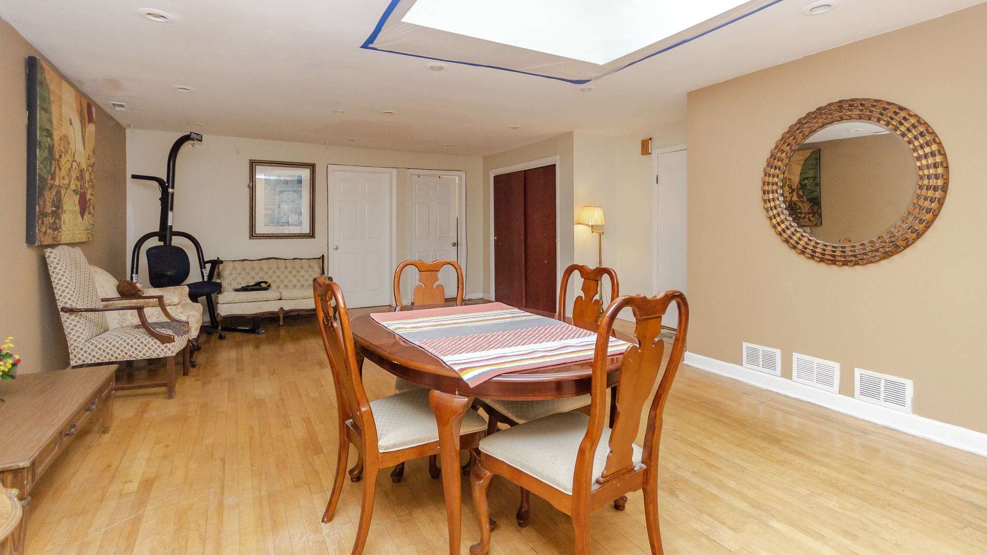 3323 North Pulaski Road Chicago, IL 60641 - Photo 3 of 12 a dining room with a wooden table and chairs