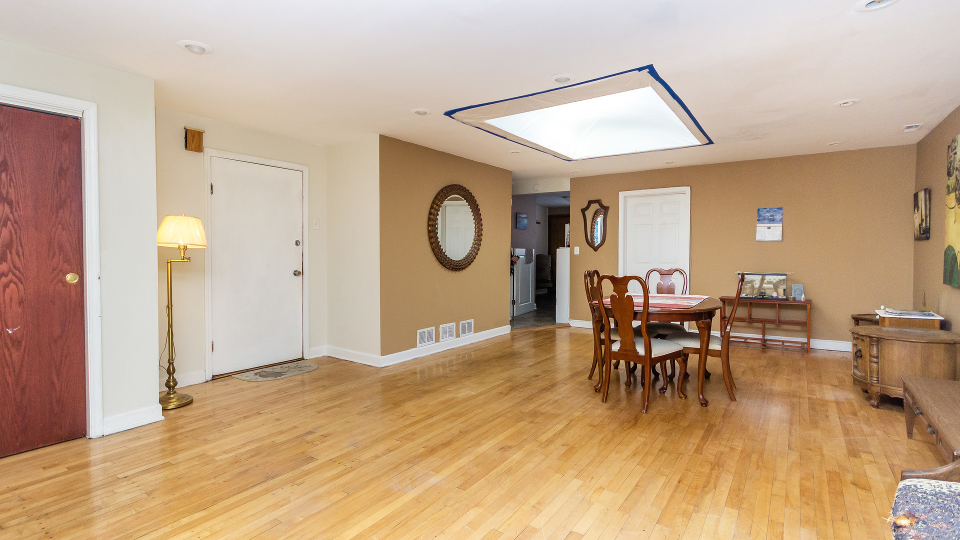 3323 North Pulaski Road Chicago, IL 60641 - Photo 4 of 12 a view of a livingroom with furniture and a dining table chair