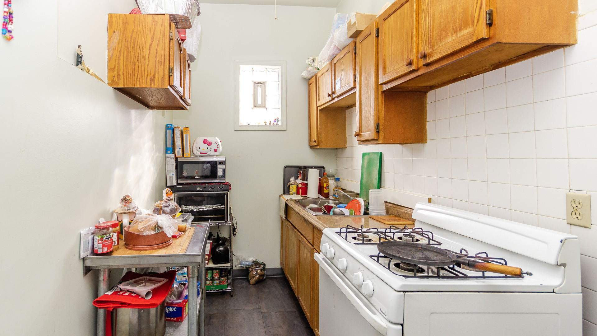 3323 North Pulaski Road Chicago, IL 60641 - Photo 9 of 12 a kitchen with a white stove and cabinets