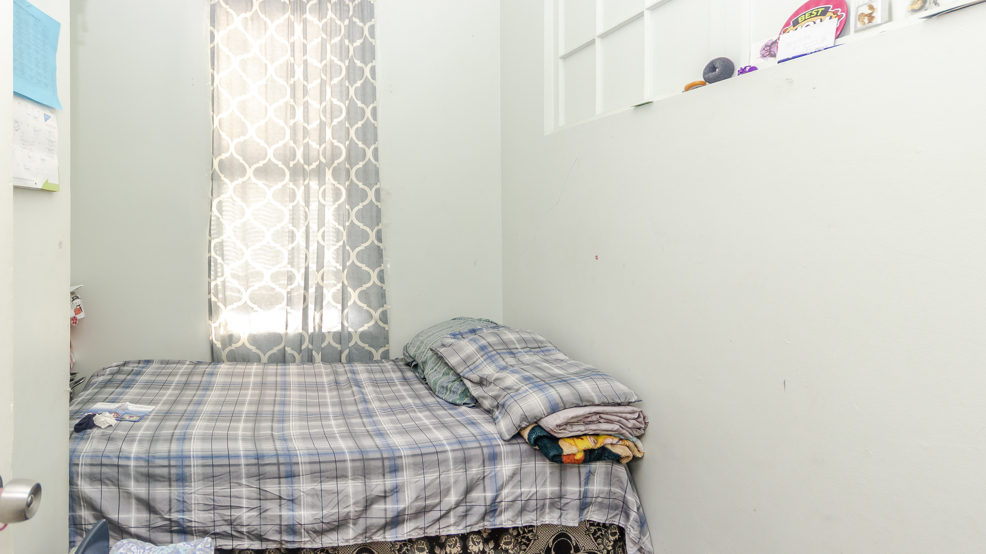 3323 North Pulaski Road Chicago, IL 60641 - Photo 10 of 12 a bedroom with a bed and a window