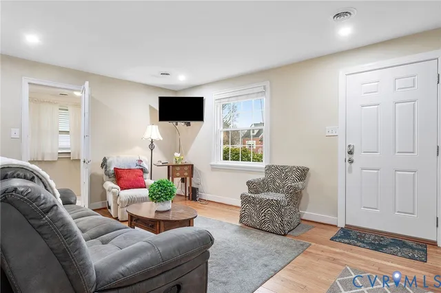a living room with furniture and a window