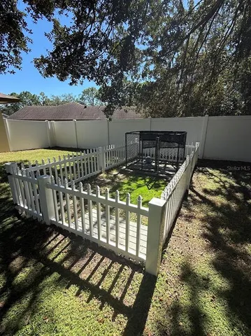 a view of a roof deck with wooden fence