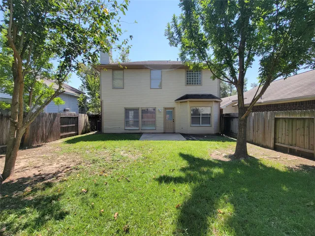 a backyard of a house with lots of green space