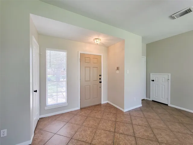 a view of an empty room and window