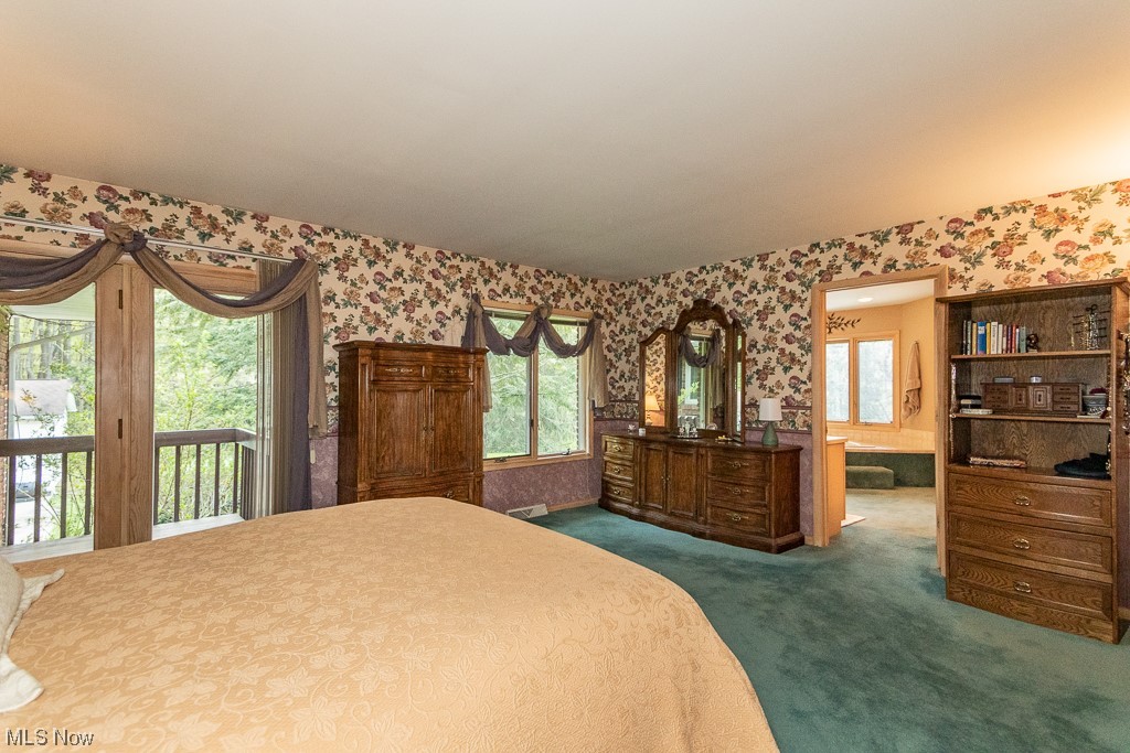 16417 Old State Road Middlefield, OH 44062 - Photo 22 of 35 Primary bedroom with private deck overlooking rear yard