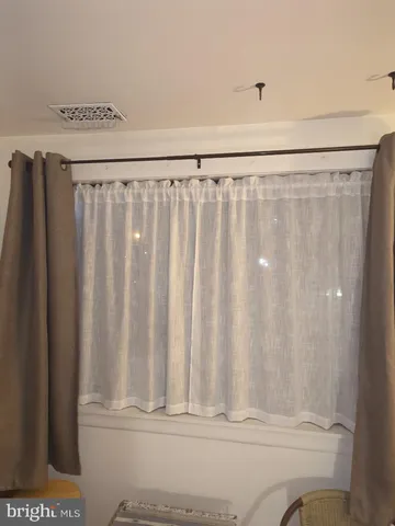 a bedroom with a bed and dresser