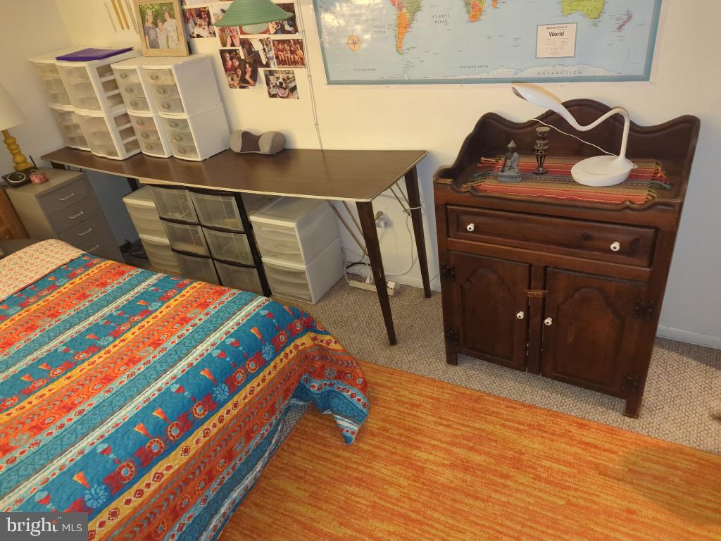 6065 Majors Lane, Unit 1 Columbia, MD 21045 - Photo 18 of 25 a bedroom with a bed and dresser