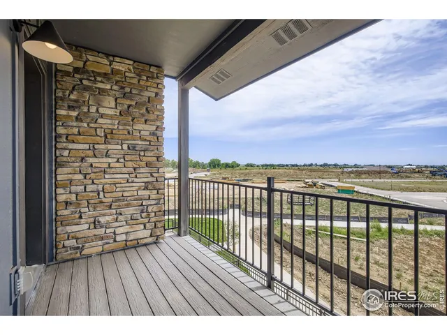a view of balcony with wooden floor