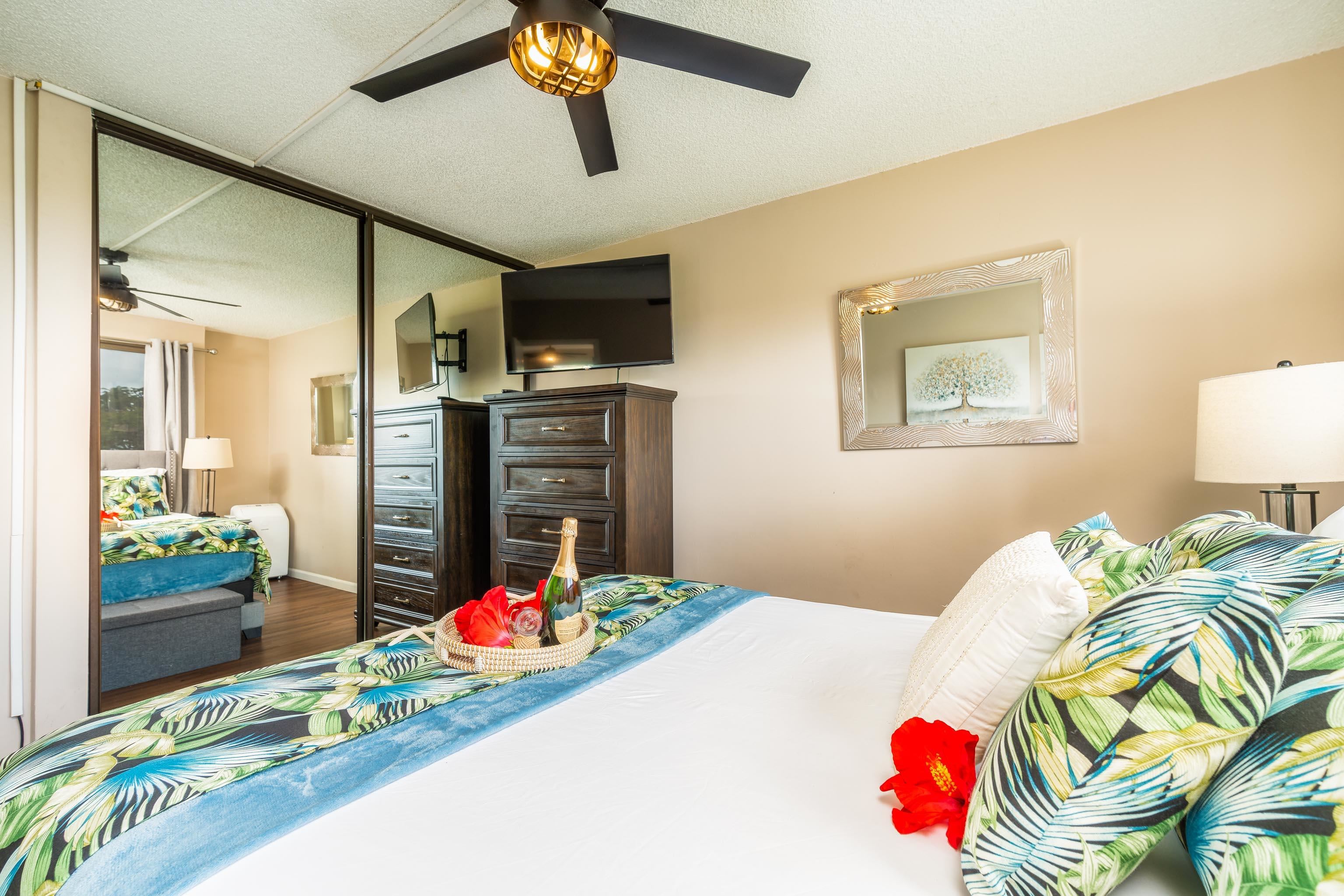 4310 Lower Honoapiilani Road, Unit 418 Lahaina, HI 96761 - Photo 15 of 31 a bedroom with furniture and a bed