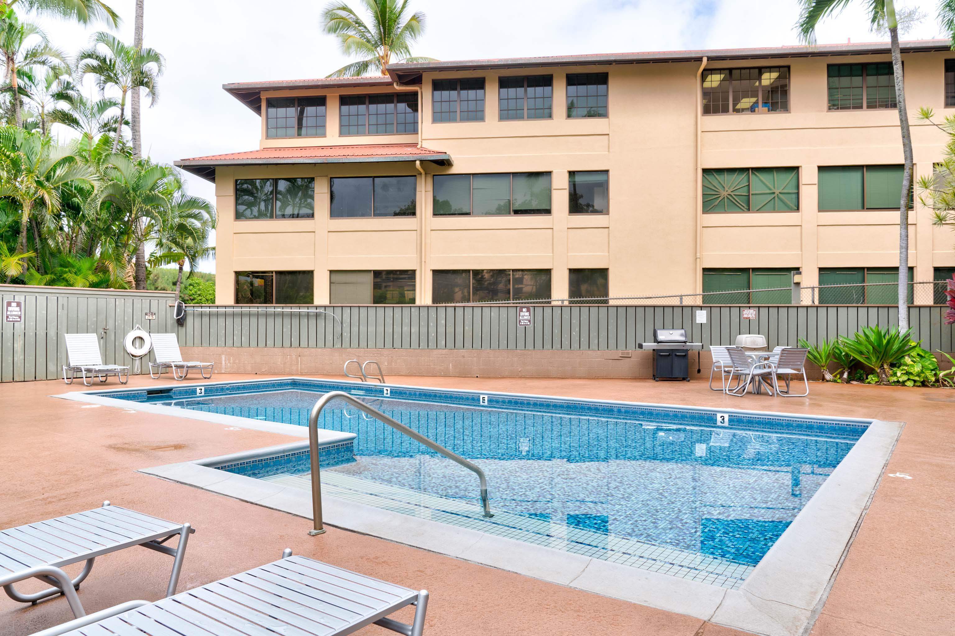 4310 Lower Honoapiilani Road, Unit 418 Lahaina, HI 96761 - Photo 23 of 31 a front view of a house with swimming pool and sitting area