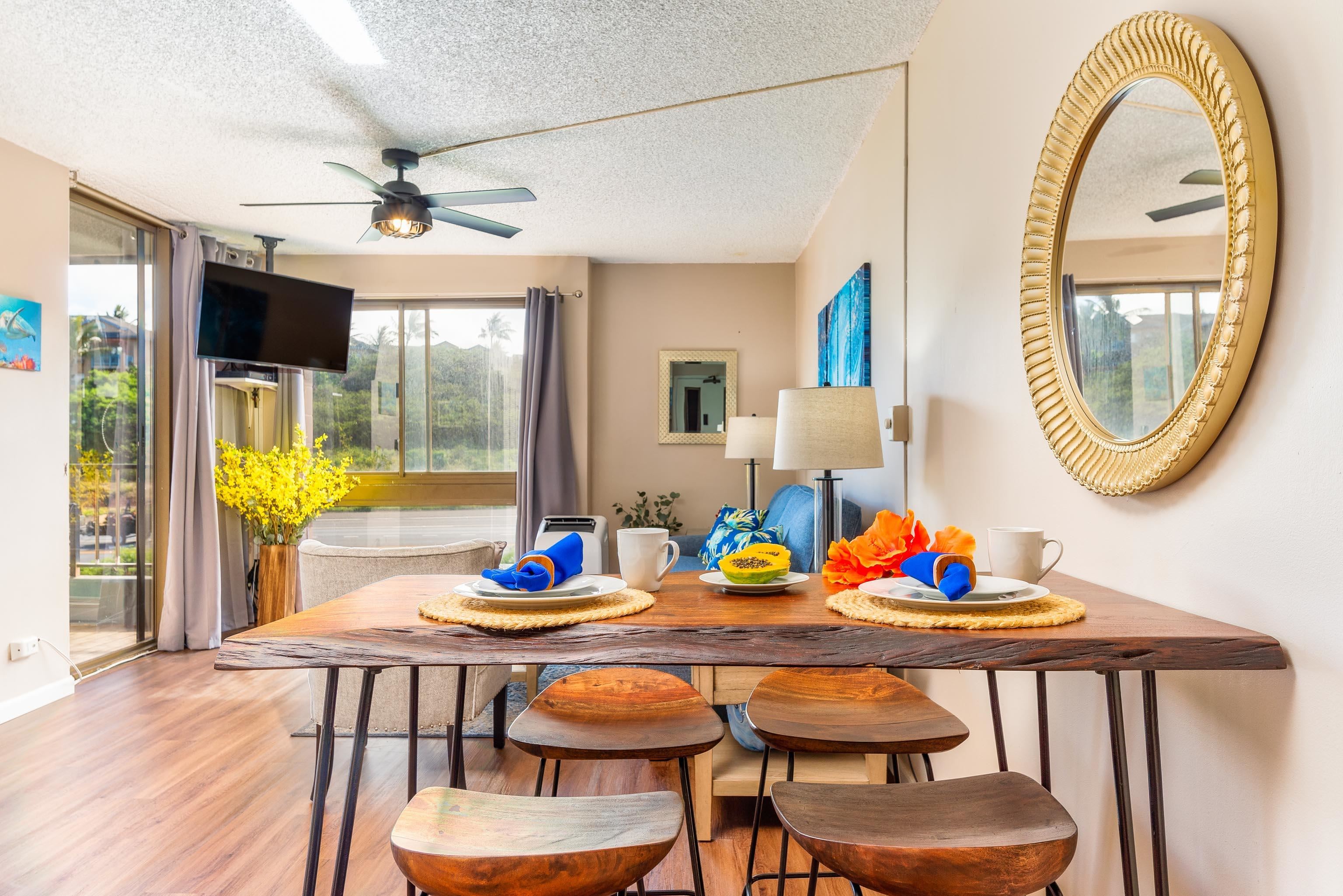 4310 Lower Honoapiilani Road, Unit 418 Lahaina, HI 96761 - Photo 3 of 31 a view of a dining room with furniture and a table