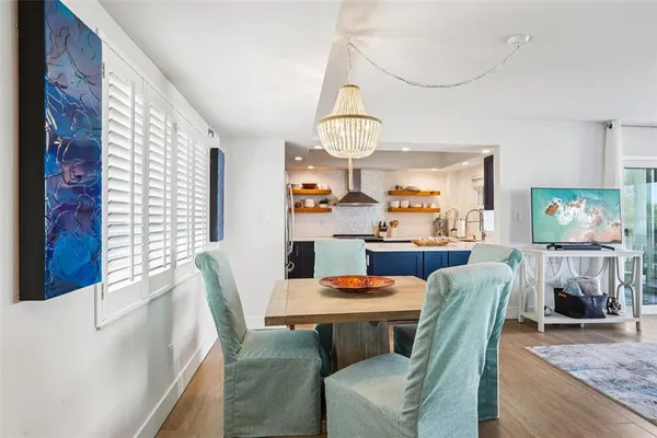 a view of a dining room with furniture window and wooden floor