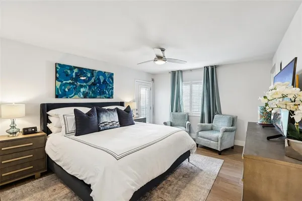 a bedroom with a bed and a couch