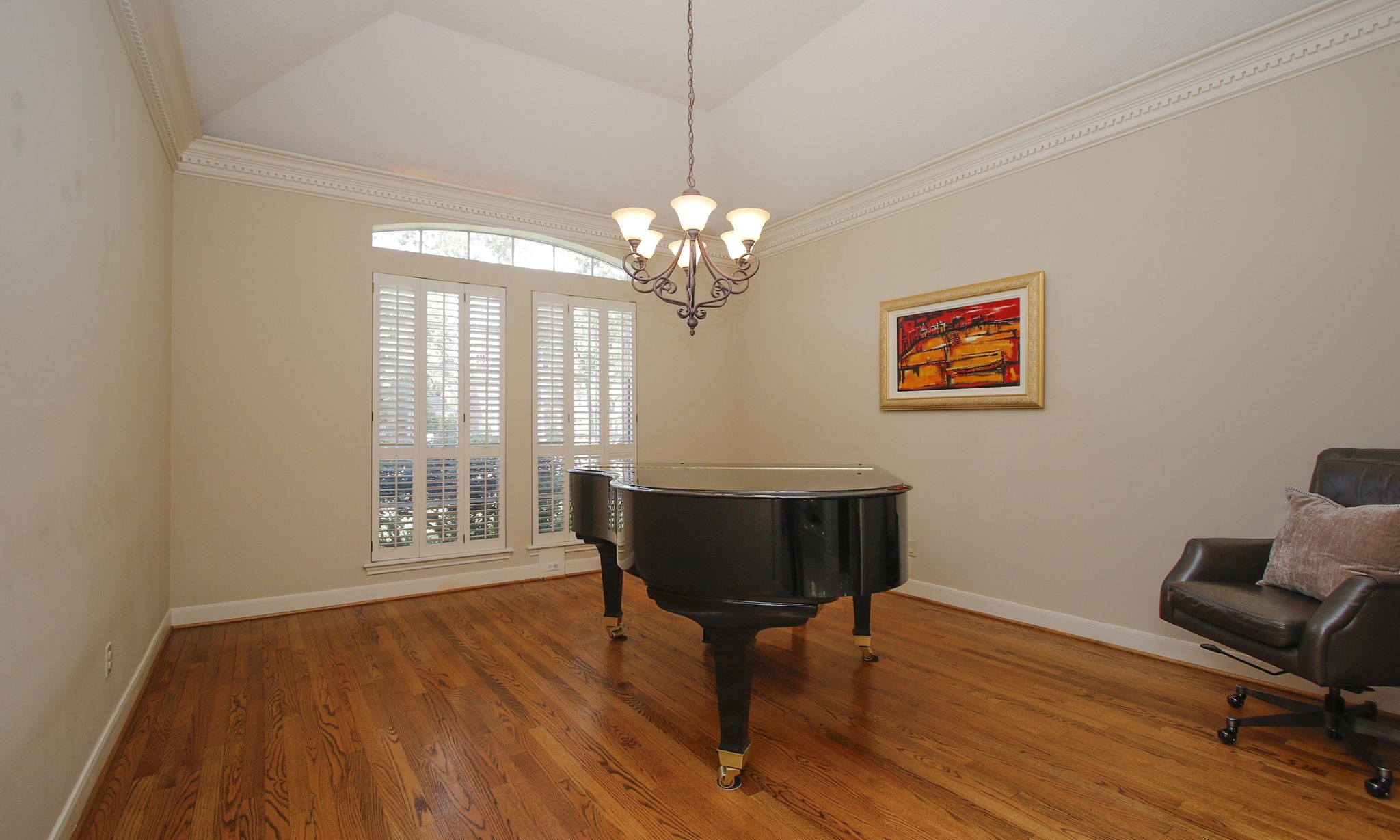 15923 Harwick Drive Spring, TX 77379 - Photo 19 of 50 The formal dining room features high ceiling, hard wood floors and plantation shutters and it located just across from the kitchen through the foyer. This owner uses the room as a music room.