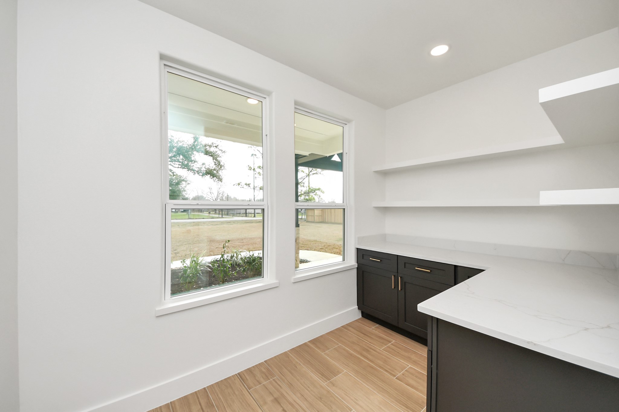 5811 County Road 675B Rosharon, TX 77583 - Photo 11 of 39 a view of an empty room with wooden floor and a window