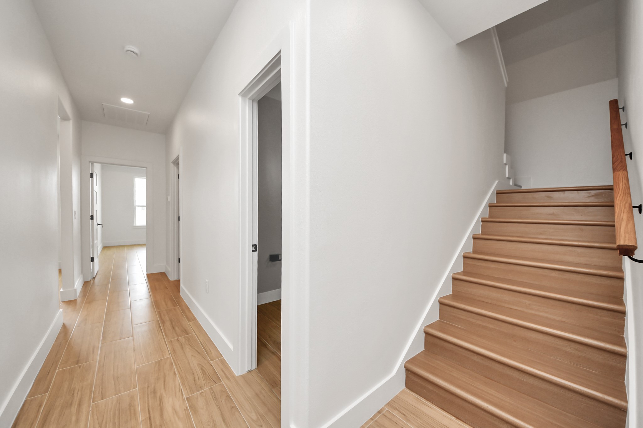 5811 County Road 675B Rosharon, TX 77583 - Photo 32 of 39 a view of a hallway with wooden floor and staircase