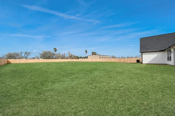 a backyard of a house with lots of green space