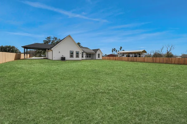 a big house with a big yard and more windows