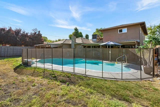 a view of a backyard with a garden and plants